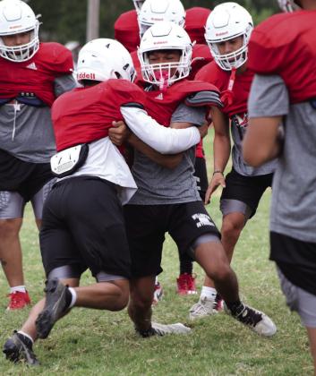 Wellington seniors, teammates put on pads for Rocket Pride