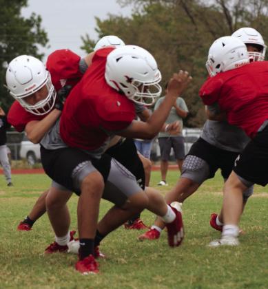 Wellington seniors, teammates put on pads for Rocket Pride