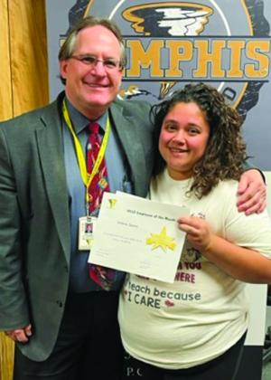 Memphis Independent School District (ISD) Superintendent William Alexander awards February Employee of the Month Andrea Carbajal, who teaches at Memphis Middle School. Photos Courtesy of Memphis ISD