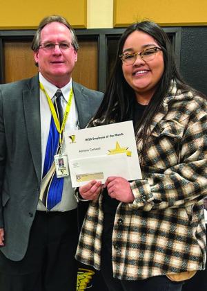 Memphis Independent School District (ISD) Superintendent William Alexander awards February Employee of the Month Selena Saenz, who teaches special education and prekindergarten at Travis Elementary School.
