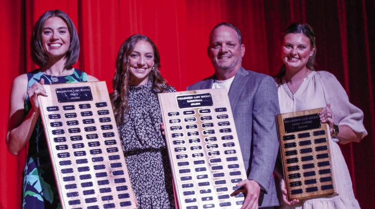 Wellington High School freshman Taytum Kane receives the Girls’ Basketball Offense Award, Girls’ Track Most Valuable Player (MVP) Award and Cross Country MVP Award, presented by Coach Coutney Head, Coach Shannon Fisher and Coach Savannah Henderson.