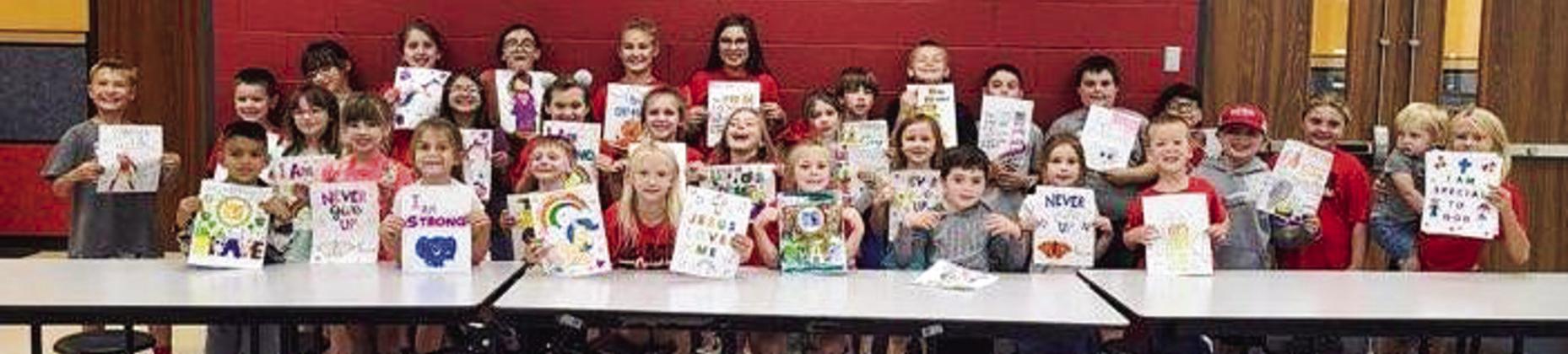 Collingsworth County 4-H Clover Kids and Sparklers display display pictures they colored for Kaydence Mixon. The daughter of Justin and Natasha Mixon, 17-month-old Kaydence is fighting Acute Myeloid Leukemia (AML). Courtesy Photo