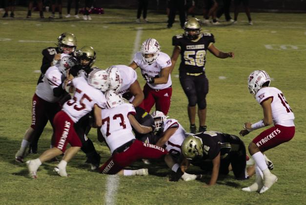 Skyrockets Dalton Holland (73), Jackson Jones (55), Nick Nevarez (79), Ramon Rodriguez (51), Caleb Strickland (50), Ethan Nevarez (44) and Anthony Ortiz (15) take down a Cyclone Friday, Oct. 13 in Memphis. The Red River Sun/Shauna Salinas