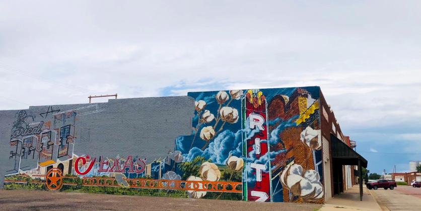By Tuesday, July 1, Malcom Byers makes a lot of progress on his Collingsworth County mural. Utilizing a combination of research in history and sourced images, sketching and compositing images on Photoshop, he develops an original design.