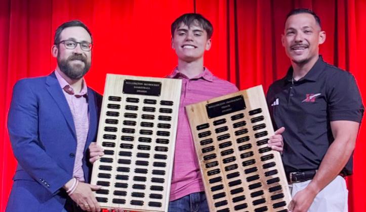 Wellington High School Freshman Jax Cantu receives the Boys’ Basketball Most Valuable Player Award, presented by Coach Colton Holmes, and the Boys’ Track Field Event Award, presented by Coach Jared Casas.