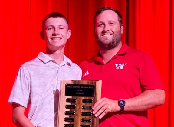 Wellington High School Junior Carter Ouellette garners the Boys’ Golf Most Valuable Player Award, presented by Coach Klark Ashmore.