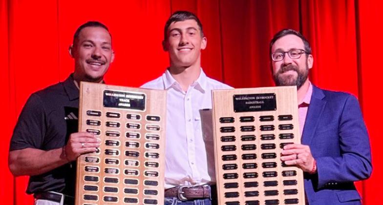 Wellington High School Junior Callen Kane accepts the Boys’ Track Sprinter Award, presented by Coach Jared Casas, and the Boys’ Basketball Offensive Award, presented by Coach Colton Holmes.