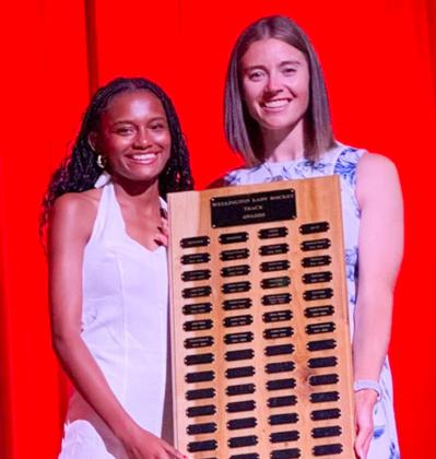Wellington High School Senior Angela Lewis accepts the Girls’ Track Most Valuable Player Award, presented by Coach Courtney Head.