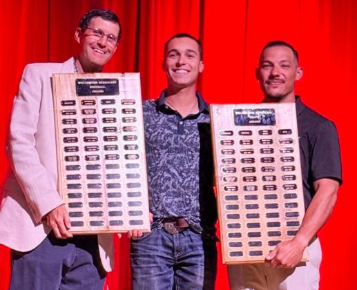 Wellington High School Senior Major Brown garners the Football Outstanding Receiver Award, presented by Athletic Director Coach Greg Proffitt, and the Boys’ Track Field Event Award, presented by Coach Jared Casas. SHAUNA SALINAS/THE GREENBELT INTREPID
