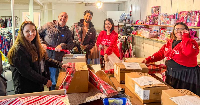 Santa’s helpers — better known as IREN employees — help wrap gifts. “Some of them were visiting from Canada and were very interested in knowing all about our charitable organization,” Childress County Christmas Sharing Board Member Raenell Smith said.
