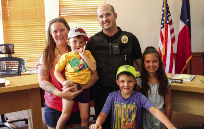 Childress Police Department Officer Glen Egerton celebrates at his swearing-in ceremony with his family.