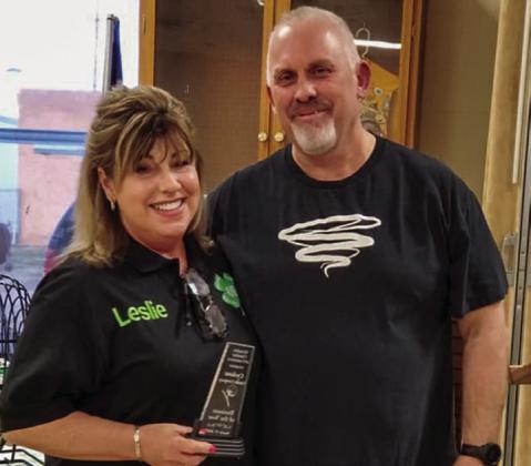 Cyclone Candle Company owner Leslie Ivy, left, accepts Business of the Year.