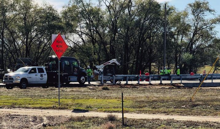 Texas Department of Transportation (TxDOT) contractors install guardrails on the FM 338 bridge in Dodson on Monday, Nov. 11. The extensive highway upgrade project began in October 2024 with replacement of the Atteberry Creek bridge. Photo by Jim Ellis