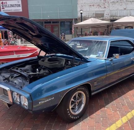 Danny Martin, of Wellington, earns a Wild &amp;amp; Free on 83 Car Show award with his ’69 Pontiac Firebird.