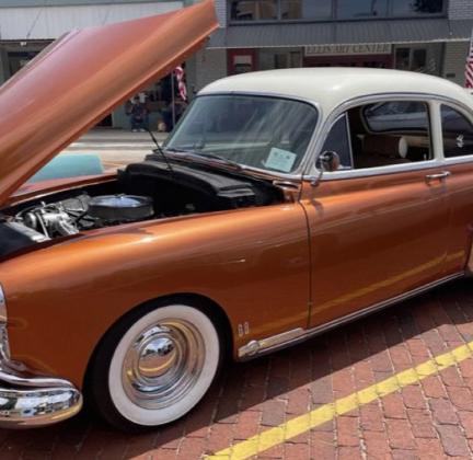 Brian Gollihare, of Hollis, Okla, displays his ’49 Oldsmobile on the downtown square of Wellington during the Wild &amp;amp; Free on 83 Car Show, where he won a fan favorite award.