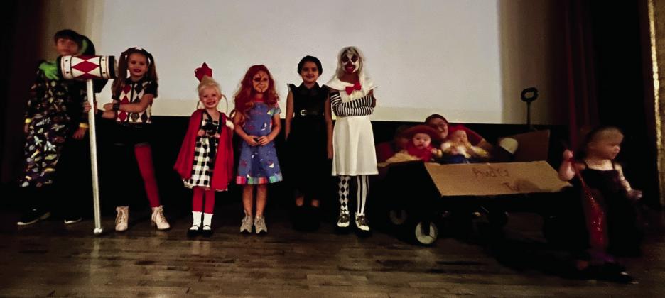 Costume contest winners enter the state of the Wellington Ritz Theatre Monday evening, Oct. 23. The contest began at 6 p.m., followed by the movie, “Room on the Broom,” at 6:30 p.m. From left: Jackson Needham, Bentley Keys, Blake Lemons, Harper Cox, Summer Valles, Kesley Hamner, Creed Patterson and Juniper Wilbur with Myka Kelch and Kaydence Mixon. Courtesy Photo