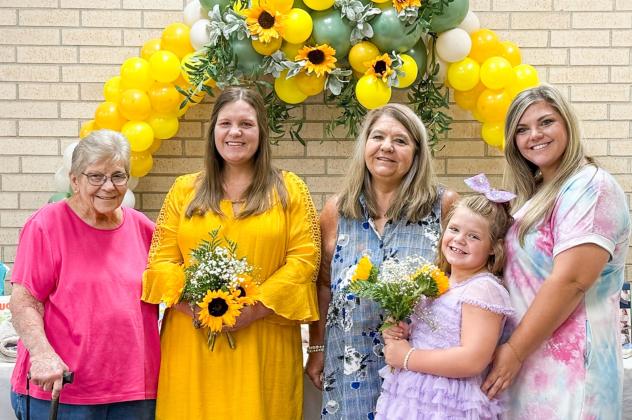 Grandmother Carole Meeks, left, guest of honor Jaci Roberson, mother Verna Wagner, niece Shayli Wagner and twin sister Joni Wagner gather amongst the gifts during the Saturday, Aug. 9 baby shower festivities. Courtesy Photo