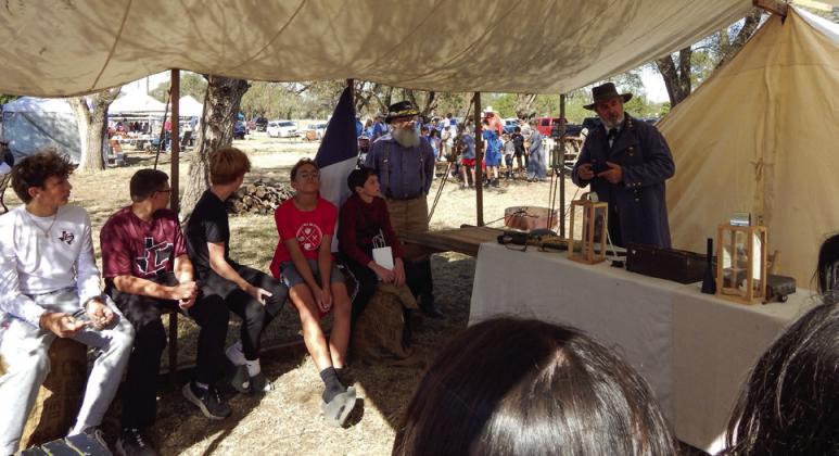 Confederate General Robert E. Lee, also known as Steve Boone, of Lamesa, shows Clarendon students relics from the American Civil War. Volunteers ushered students from one history station to the next as reenactors presented their history lessons.