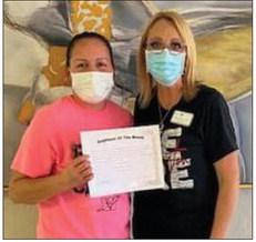 Wellington Care Center Administrator Nikki Hathaway, right, recognizes Virginia Granadoz as Certified Nurse Aid of the Month. She received a certificate and Walmart gift card. “Thank you for being someone we can always count on,” Hathaway said. Courtesy Photos