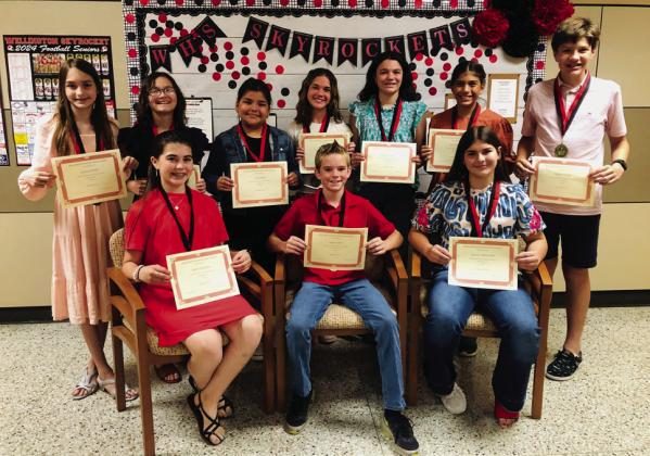 Wellington Junior High School sixth-grade Top 10 students accept accolades. Front row, from left: Quinn Roberson, first; Radley Keys, second; Rachel Strickland, third. Back row, from left: Jessalee Peters, fourth; Brianna Torrez, fifth; Tylee Wiebe, sixth; Adeline Deady, seventh; Kenzlea Taylor, eighth; Seveyah Pena, ninth; Pierson Dwyer, 10th. The Red River Sun/Bev Odom