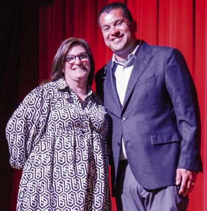 Lana Tillman, left, accepts the Smart/Maher Veterans of Foreign Wars (VFW) National Citizenship Education Teacher Award during the May 12 Wellington High School (WHS) Academic and All-Sports Awards Ceremony. WHS Principal Jermaine Cantu, who nominated Tillman, presented her with the $150 award from the Glynn Moore VFW Post 6439 Auxiliary. The Red River Sun/Shauna Salinas