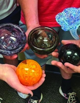 Wellington students display their glassblowing creations.