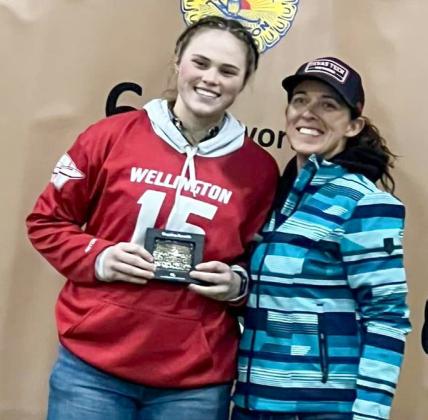 Wellington High School senior Briley Waters accepts the Herdsman Award buckle, in memory of the late Don Reeves, from Collingsworth County Livestock Show President Marcie Orr. Watch for additional CCLS photos in future issues of “The Red River Sun.”