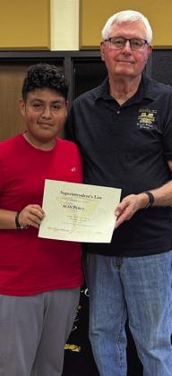 Eighth-grader Alan Perez is awarded by Vice President Donnie Carroll.