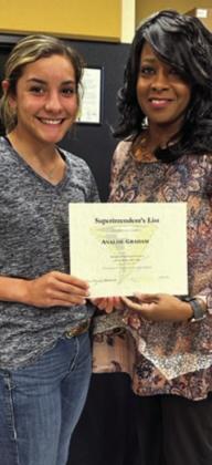 Freshman Ana Graham is awarded by board member Charlotte Maddox.