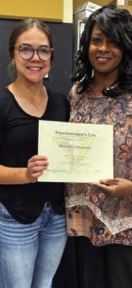Junior Macaela Graham is awarded by board member Charlotte Maddox.