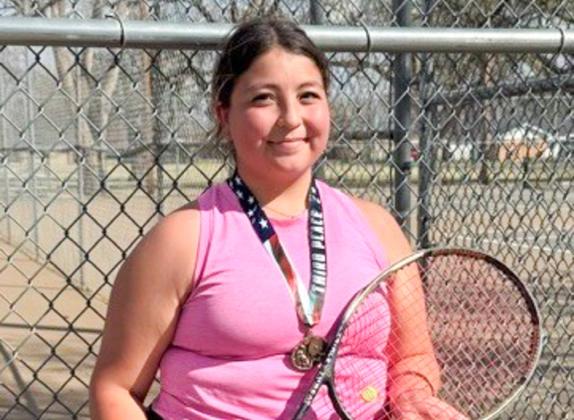 Bella Bohannon receives the girls’ singles third-place bronze medal at the Wellington Tournament. Bailey Page, not pictured, won the fourth-place girls’ singles award.