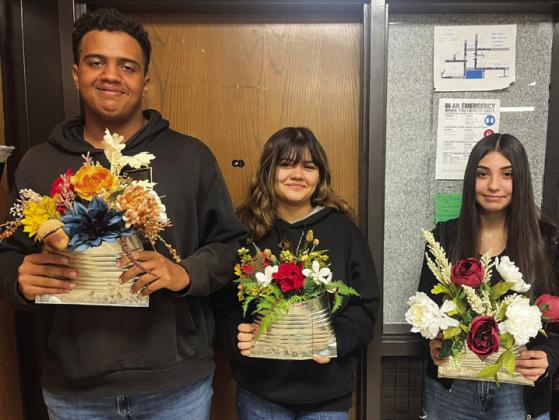 Floral design students repurpose pumpkins, tin cans