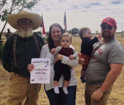 Rocky Sprott Living History Weekend event co-chairman Darrell Colson, left, presents the first-place Ice Cream Freeze-Off prize of $250, sponsored by BRIX Bar and Eatery, to Samantha and Bo Bohannon with Ryder and Brice. Courtsey Phtotos
