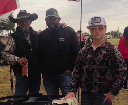Claiming second-place in the Chili Cookoff is Big Hat At A Bar, with Heath Blacksher, left, Justin Tarver, Castin Tarver. J.J. Blacksher served as another cook.. Wellington State Bank sponsored the $200 prize for the Saturday morning contest.
