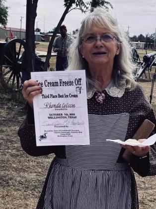 Third-place Ice Cream Freeze-Off winner Salt Mine - Rhonda Colson displays her award of $50, sponsored by Wellington Tractor Parts. Colson also garnered the thirdplace Chili Cookoff award of $100, sponsored by Bawcom Fuels Inc.