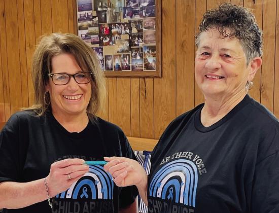 Cristin Davis, left, accepts the chairmanship of Collingsworth County Child Protective Service Child Welfare Board at its recent meeting from Saunna Blacksher, chairman of the board for 30 years. “Be Brave” reads the inscription on the pen, passed from Blacksher to Davis, from one chairman to another. Collingsworth County CPS Child Welfare Board