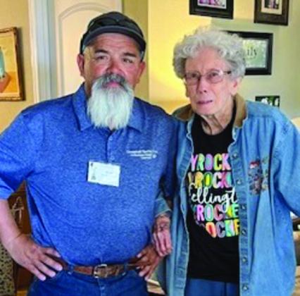 Greenbelt Electric Cooperative Lineman Juan Martinez presents Bonnie Guthrie with an $850 cash grand prize. Guthrie won one of two 85th annual meeting grand prizes on Friday, Sept. 27.