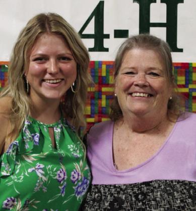 Savannah Rabe, left, recognizes volunteer Judi Wiseman.
