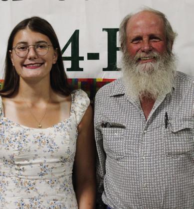 Taylor Wiseman, left, recognizes volunteer Stan Chapman.