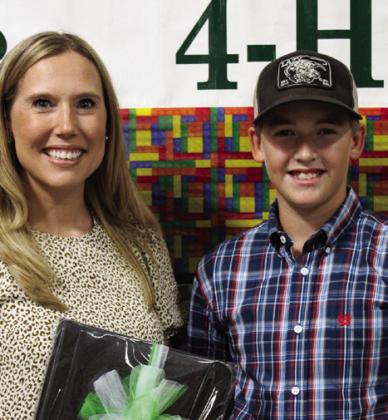 Slade Chapman, right, recognizes volunteer Amanda Schaefer.
