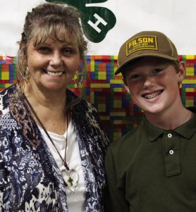 Ryker Schaefer, right, recognizes volunteer Sandy Koepke. The Red River Sun/Elizabeth Tanner Not pictured is volunteer Susan Leary.