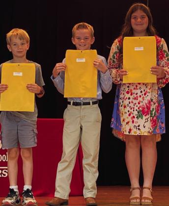 Stacie Smith’s fourth graders accept A Honor Roll and American Citizenship awards as follows. From left: Isaac Lewis, A Honor Roll, American Citizenship; Jessalee Peters, A Honor Roll; Quinn Roberson, A Honor Roll.