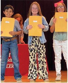 Stacie Smith’s fourth graders accept A-B Honor Roll and Perfect Attendance awards as follows. From left: Ryker Killian, A-B Honor Roll; Tatum Martin, A-B Honor Roll, Perfect Attendance; Abbygale Torrez, A-B Honor Roll.