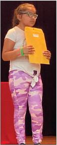 Natalia Castaneda, a fourth-grade student of Stacie Smith, accepts Most Improved.
