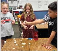 Second-graders Makenzie Smith, left, Bentley Keys, Zackery Nunez.