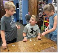 Third-graders Hoyt Warren, left, Joe Lemons, Raylie Sims.
