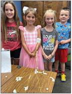 Second-graders Blair Ward, left, Jenna Faulks, Perrie Reyna, Kacen Wiebe.