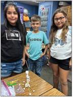 Third-graders Zariyah Reyes, left, Caleb Peters, Zoey Flores.