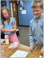 Third-graders Briley Holton, left, Destin Shotswell.