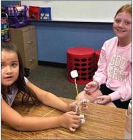 Third-graders Summer Valles, left, Piper Barnes.